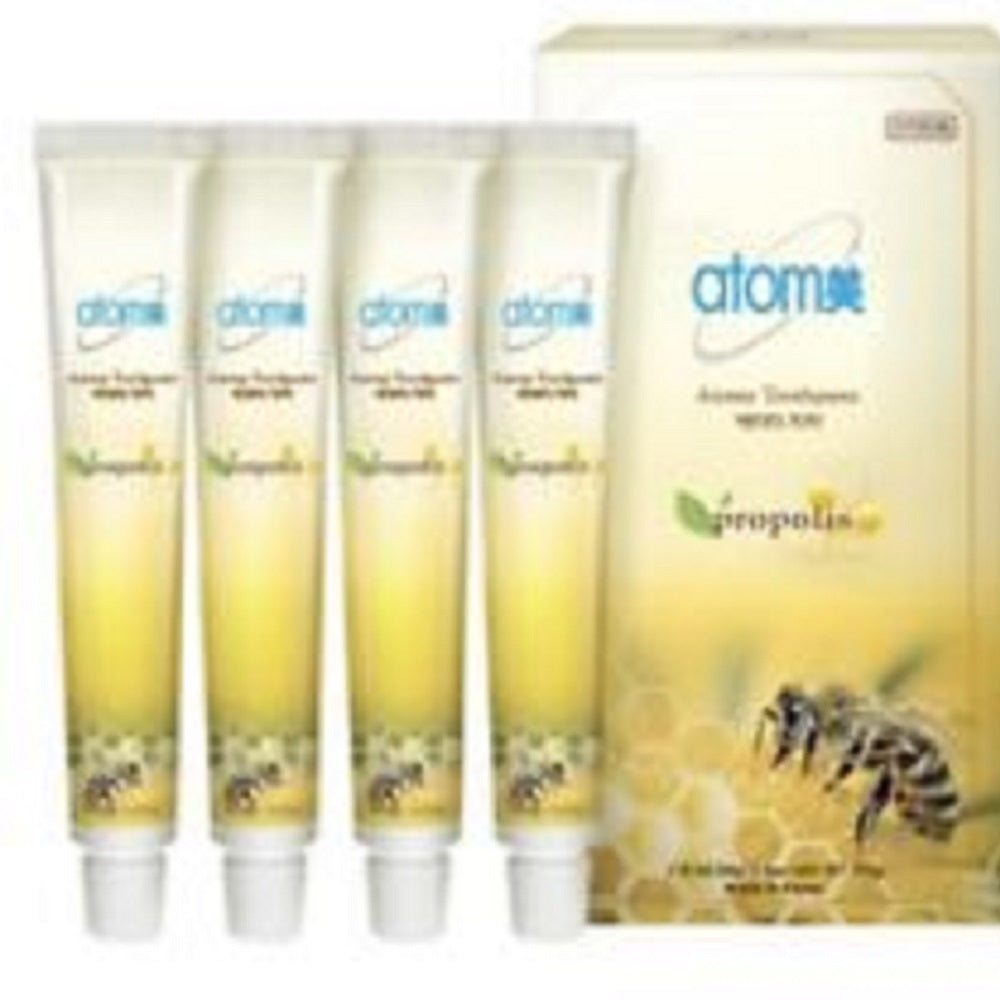 Atom Propolis toothpaste with packaging on a white background