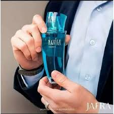 Person holding a blue and green vape device with 'JAFRA' branding.