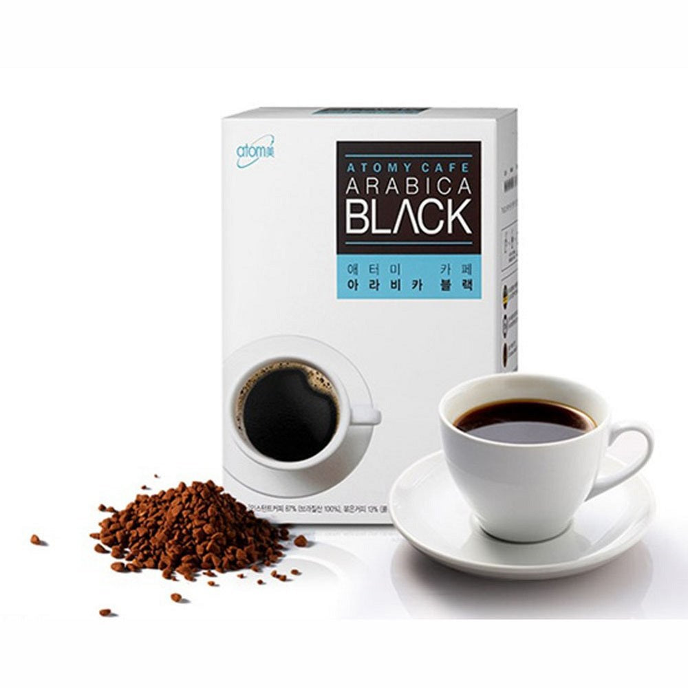 Atomy Cafe Arabica Black coffee packaging with a cup of coffee and coffee grounds on a white background