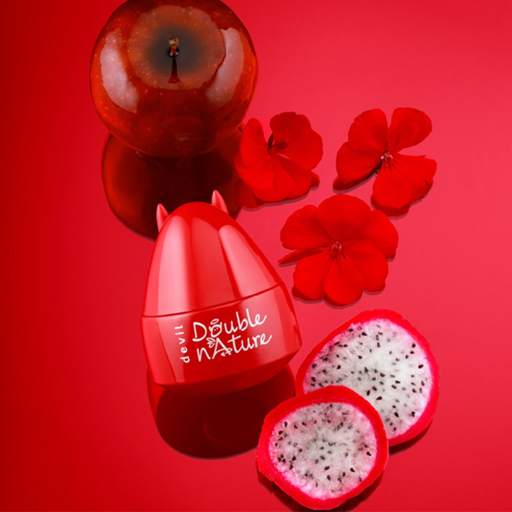 Red skincare product with dragon fruit and flowers on a red background