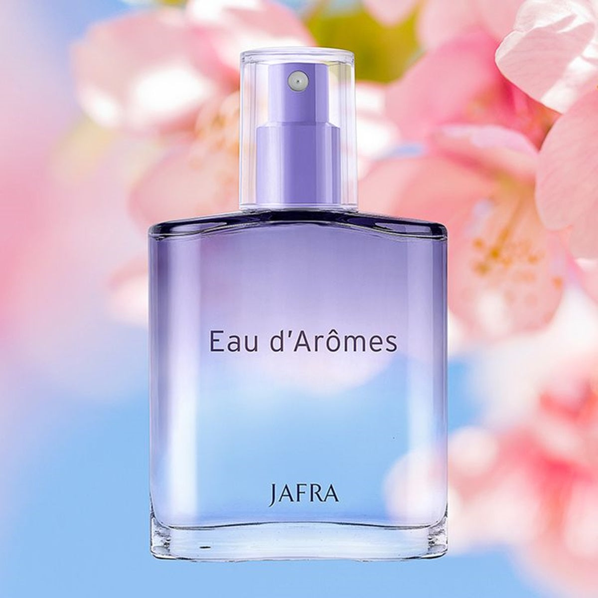 Perfume bottle labeled 'Eau d'Arômes' by JAFRA with a floral background