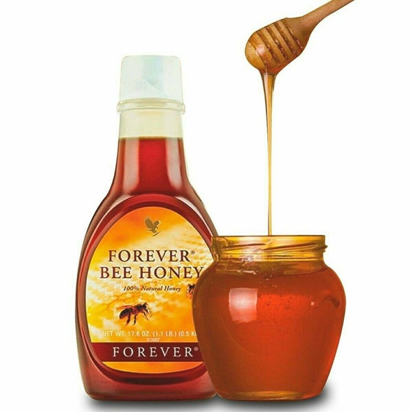 Bottle and jar of Forever Bee Honey with a wooden honey dipper.