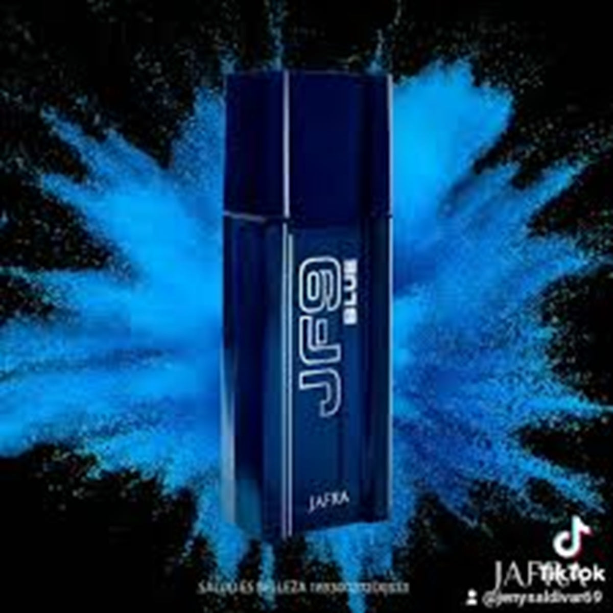 Blue bottle with 'JAFRA' branding against a black background with blue powder effects.