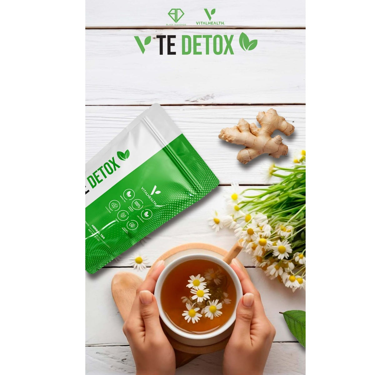 Tea packaging with a cup of tea, ginger root, and flowers on a wooden surface with Vithealth TE Detox branding.