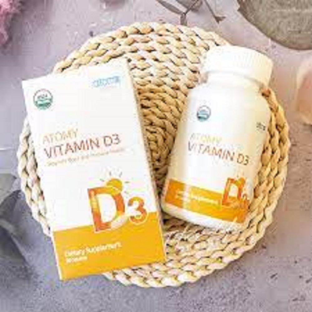 Vitamin D3 supplement bottle and packaging on a woven mat
