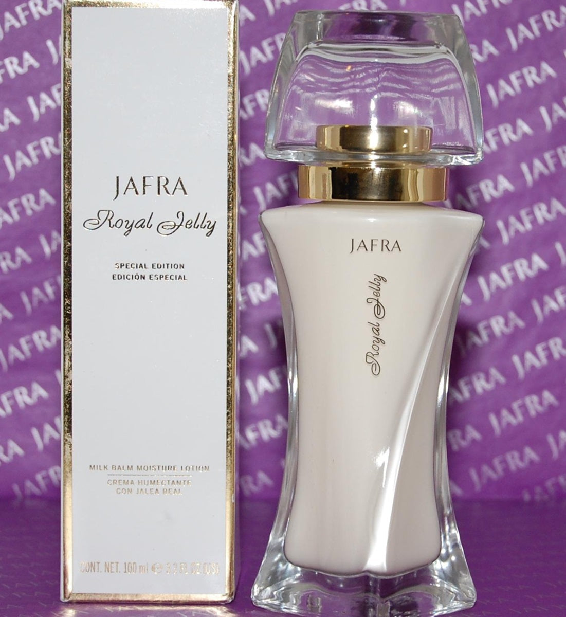 Jafra Royal Jelly perfume bottle and packaging on a purple background with 'Jafra' branding.