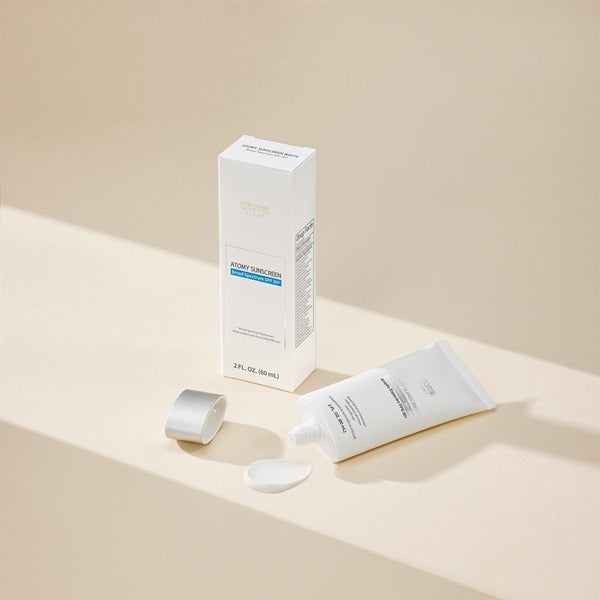 Skincare product packaging including a tube and box on a beige background